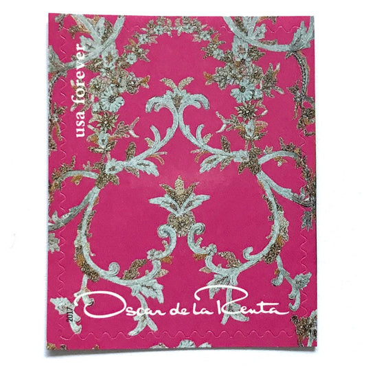 Oscar de la Renta Pink Fabric postage stamp from 2017 featuring bright pink fabric with metallic floral design on unused USPS Forever postage, Scott 5173b.