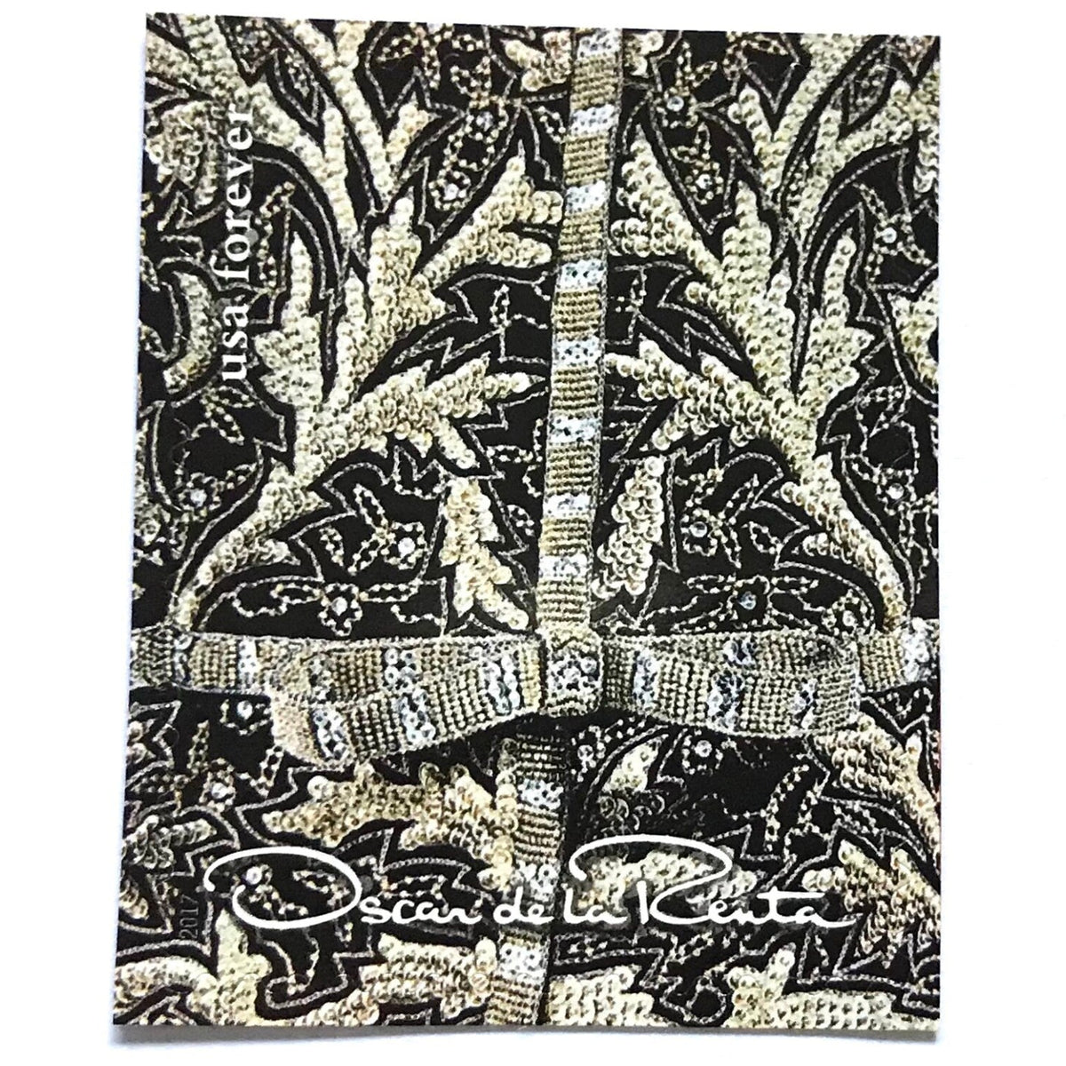 Oscar de la Renta Black Fabric postage stamp from 2017 featuring black fabric with gold and white design on unused USPS Forever postage, Scott 5173d.