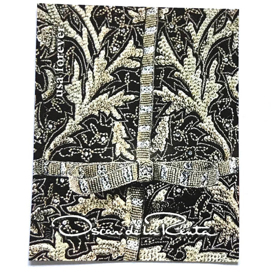 Oscar de la Renta Black Fabric postage stamp from 2017 featuring black fabric with gold and white design on unused USPS Forever postage, Scott 5173d.