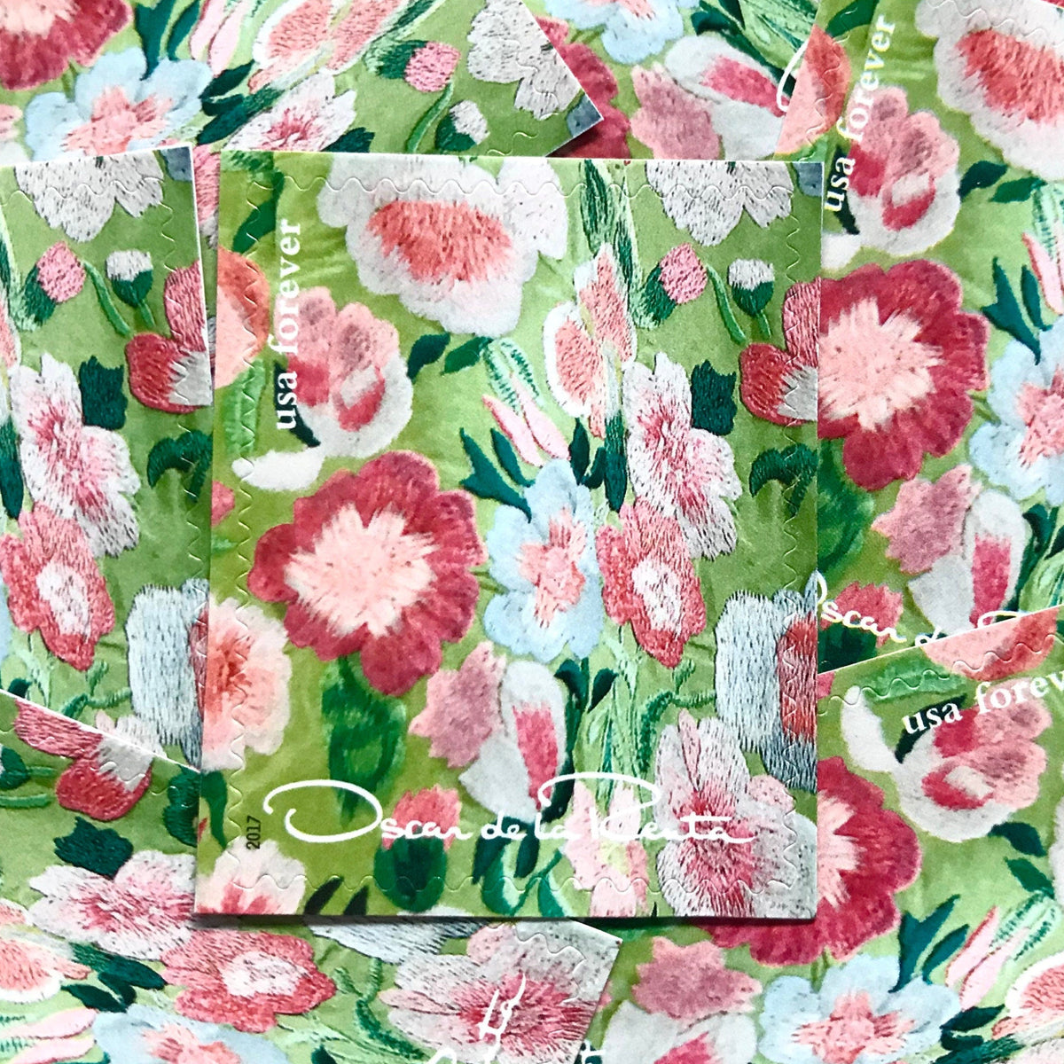 Oscar de la Renta Green Fabric postage stamps from 2017 featuring green fabric with pink floral pattern on unused USPS Forever postage, Scott 5173f.