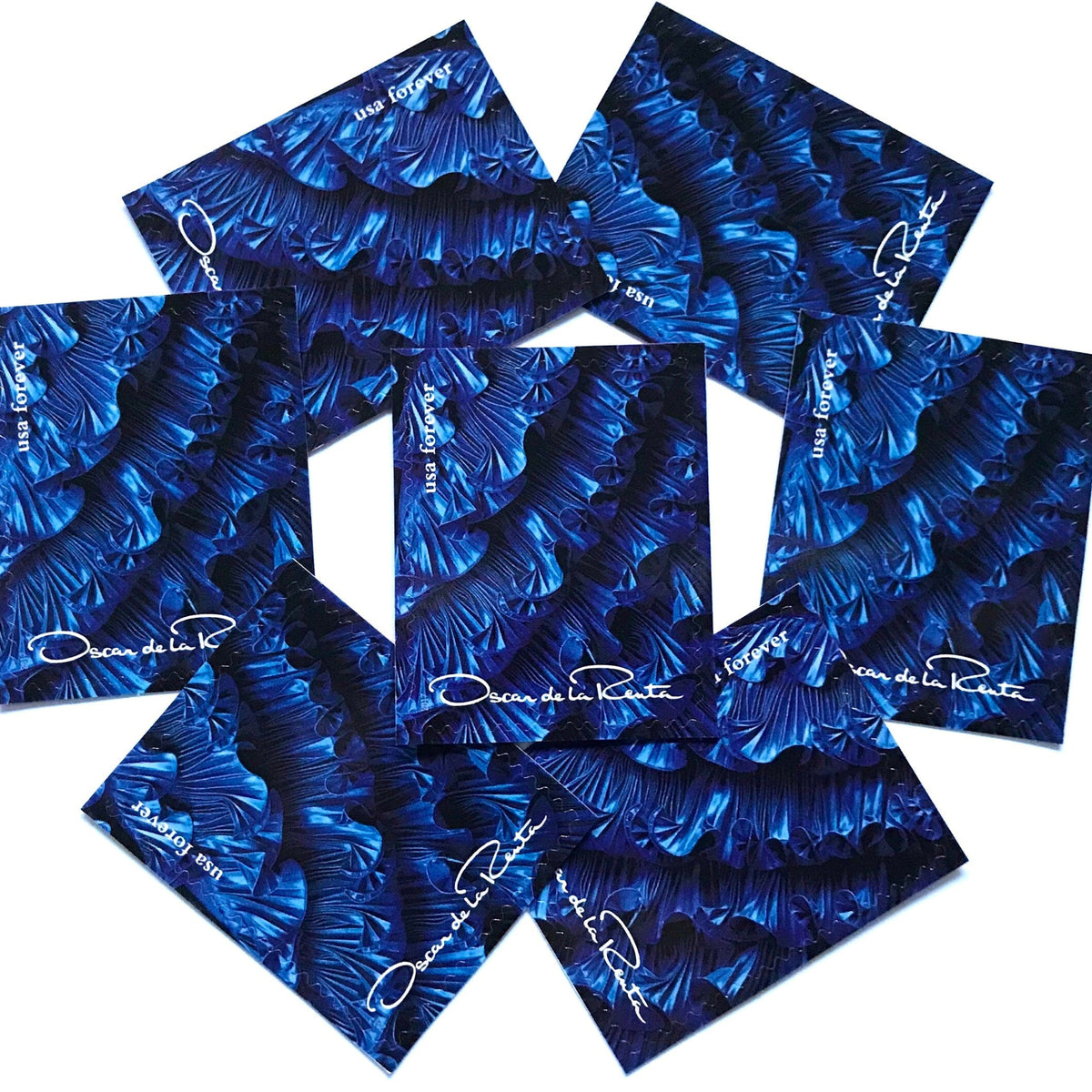 Oscar de la Renta Blue Dress Ruffles postage stamps from 2017 featuring a blue couture dress with ruffled detail on unused USPS Forever postage, Scott 5173g.