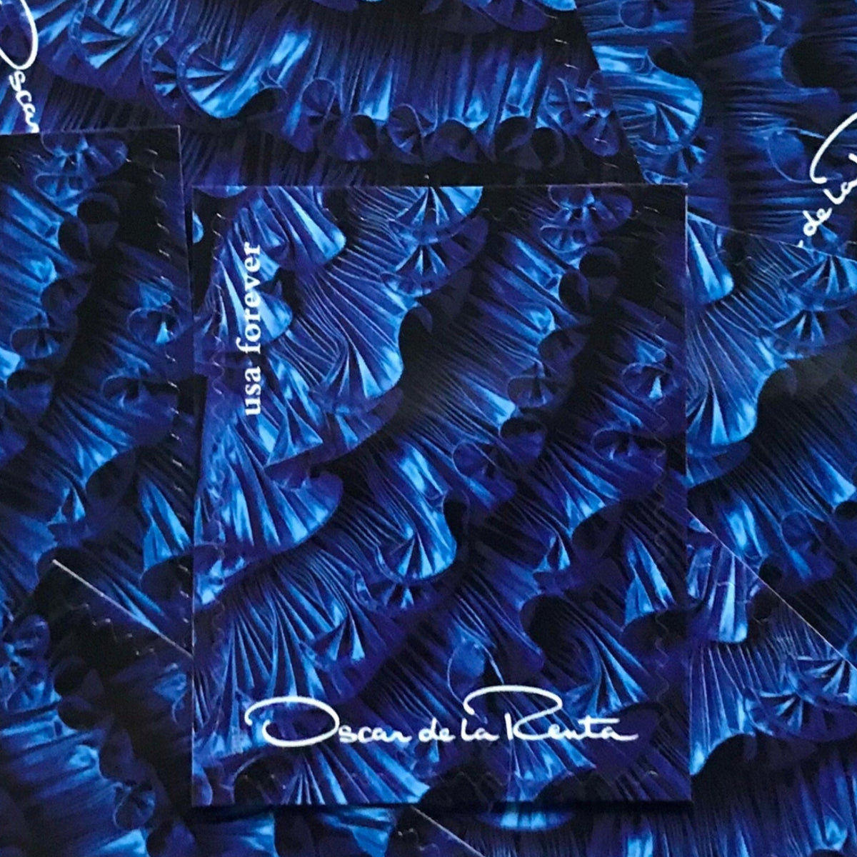 Oscar de la Renta Blue Dress Ruffles postage stamps from 2017 featuring a blue couture dress with ruffled detail on unused USPS Forever postage, Scott 5173g.