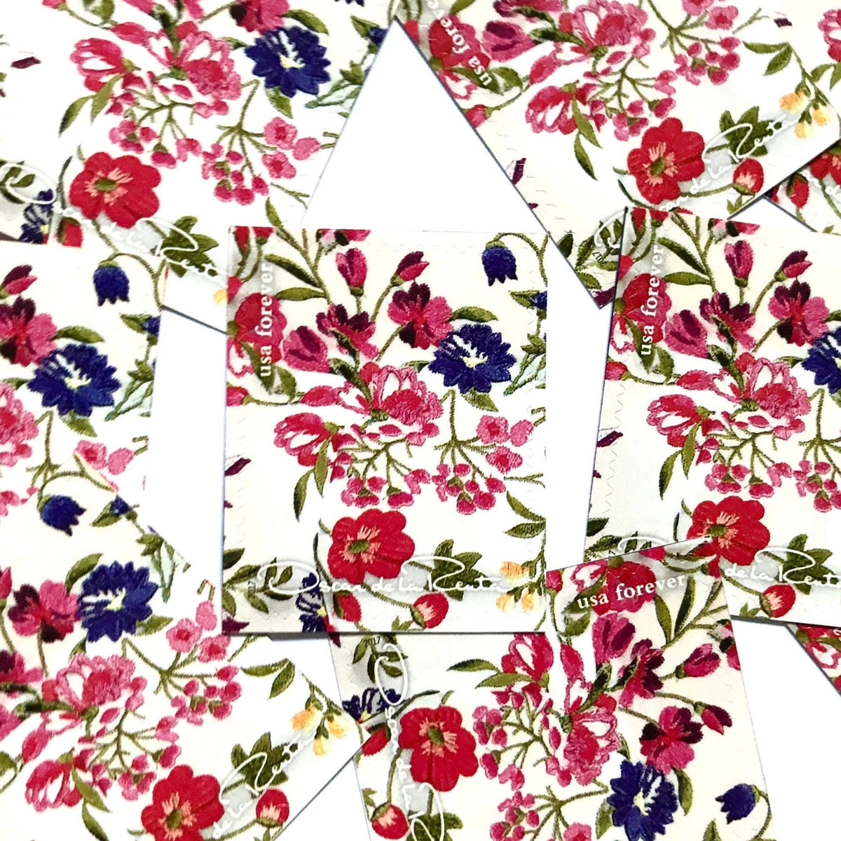 Oscar de la Renta White Floral Fabric postage stamps from 2017 featuring a floral fabric pattern with white background on unused USPS Forever postage, Scott 5173h.