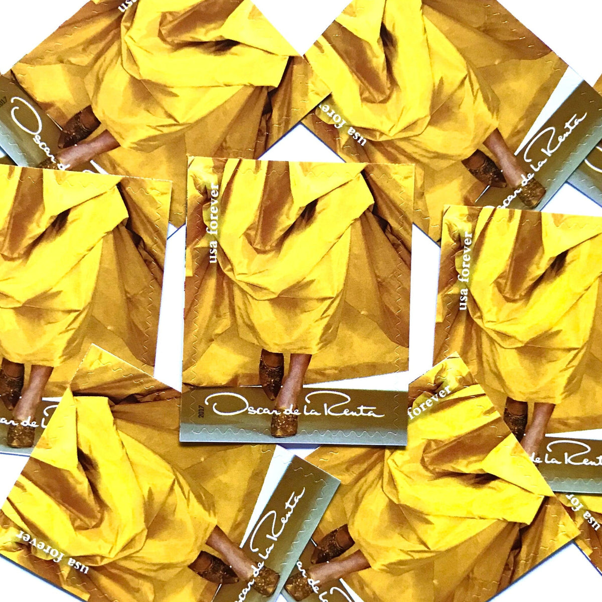 Oscar de la Renta Yellow Dress postage stamps from 2017 featuring a yellow couture dress on unused USPS Forever postage, Scott 5173i.