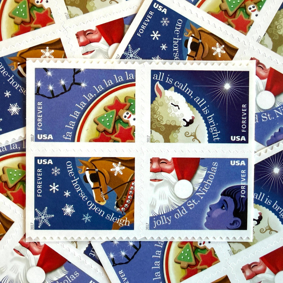 Christmas Carols four-stamp set from 2017 featuring Deck the Halls, Silent Night, Jingle Bells, and Jolly Old Saint Nicholas on unused USPS Forever postage, Scott 5247 to 5250.