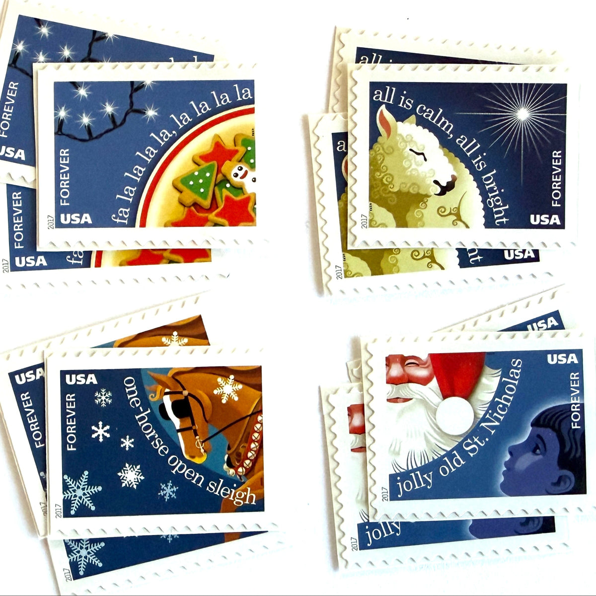 Christmas Carols four-stamp set from 2017 featuring Deck the Halls, Silent Night, Jingle Bells, and Jolly Old Saint Nicholas on unused USPS Forever postage, Scott 5247 to 5250.