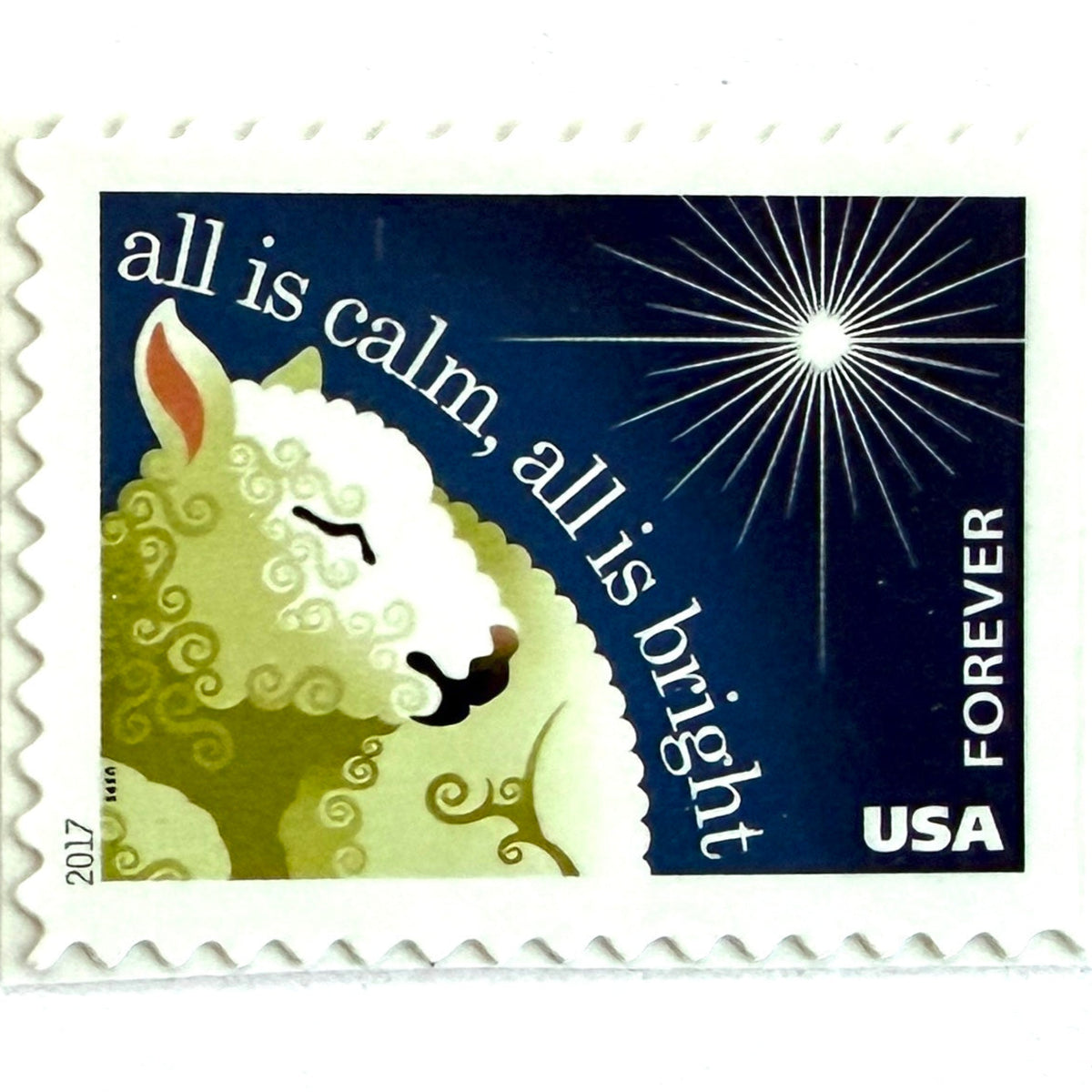 Silent Night postage stamp from 2017 featuring a sheep beneath a peaceful evening sky inspired by the classic Christmas carol on unused USPS Forever postage, Scott 5248.