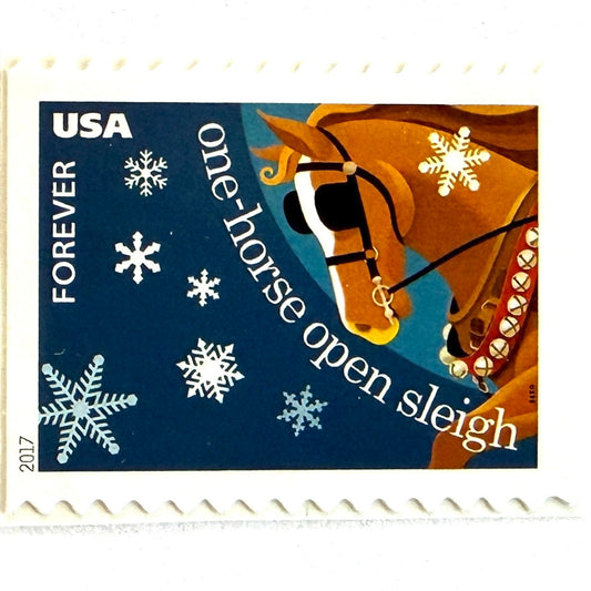 Jingle Bells postage stamp from 2017 featuring a horse pulling a sleigh through a snowy winter scene inspired by the classic Christmas carol, on unused USPS Forever postage, Scott 5249.