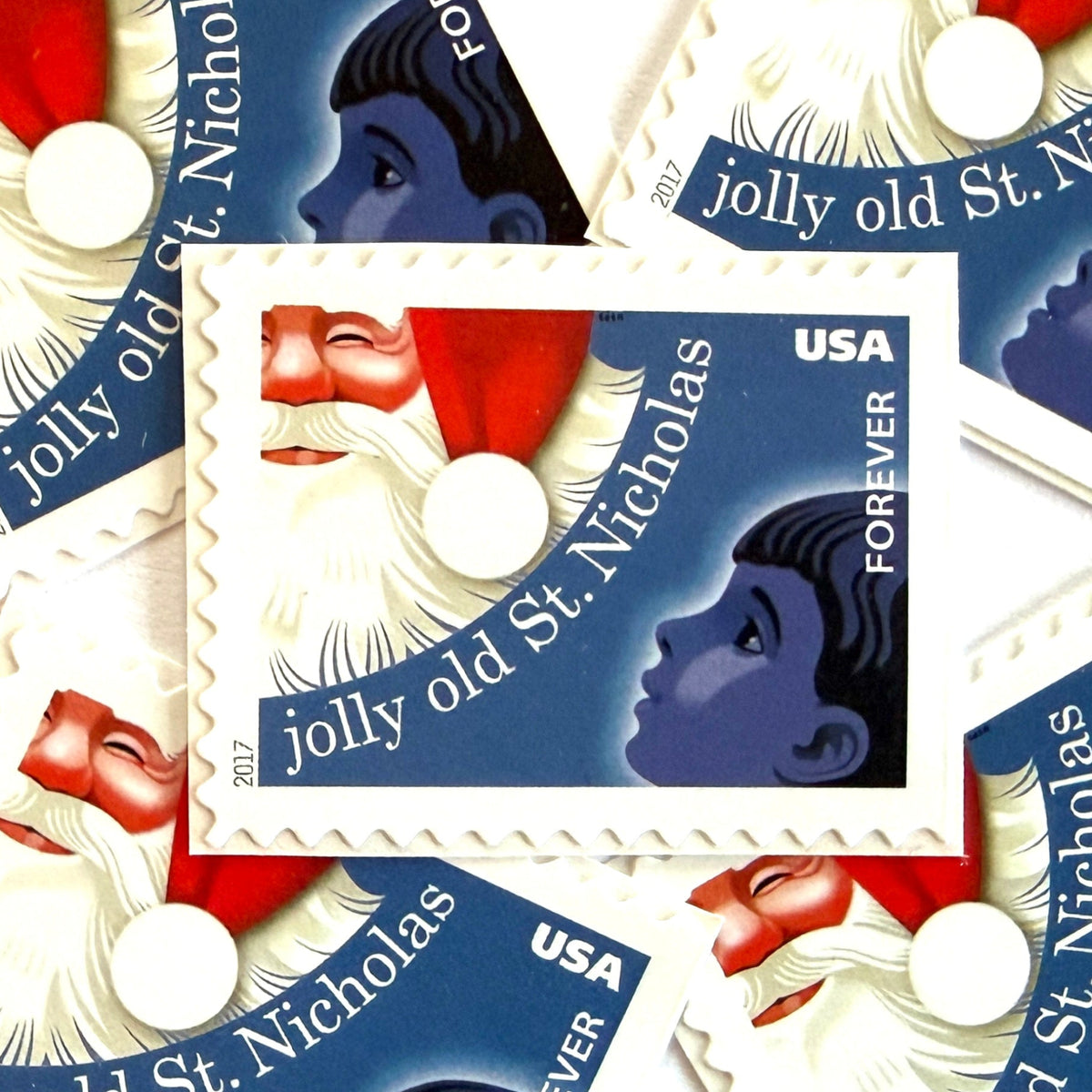 Jolly Old Saint Nicholas postage stamps from 2017 featuring Santa Claus with a child inspired by the traditional Christmas carol on unused USPS Forever postage, Scott 5250.