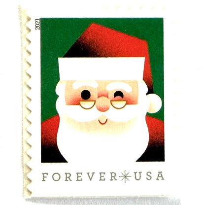 Head of Santa Claus postage stamp from 2021 featuring a close-up of a smiling, winking St. Nick against a green background on unused USPS Forever postage, Scott 5646.
