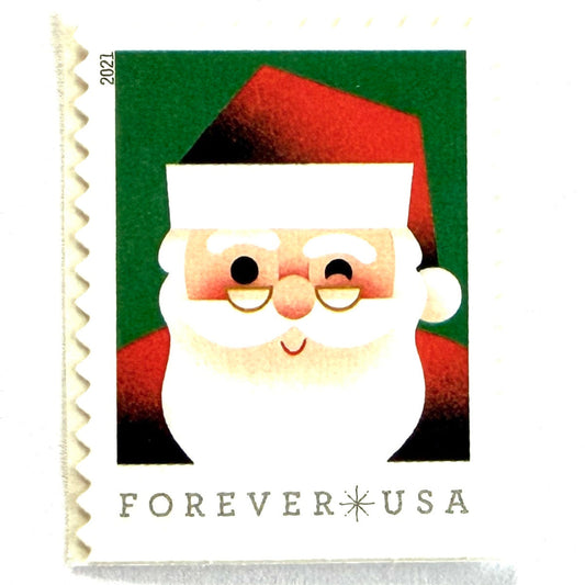 Head of Santa Claus postage stamp from 2021 featuring a close-up of a smiling, winking St. Nick against a green background on unused USPS Forever postage, Scott 5646.