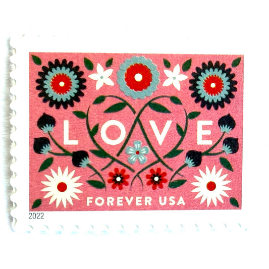 Love 2022 coral pink floral postage stamp featuring folk-art flowers, twisting vines, and abstract hearts on unused USPS Forever postage, Scott 5661.