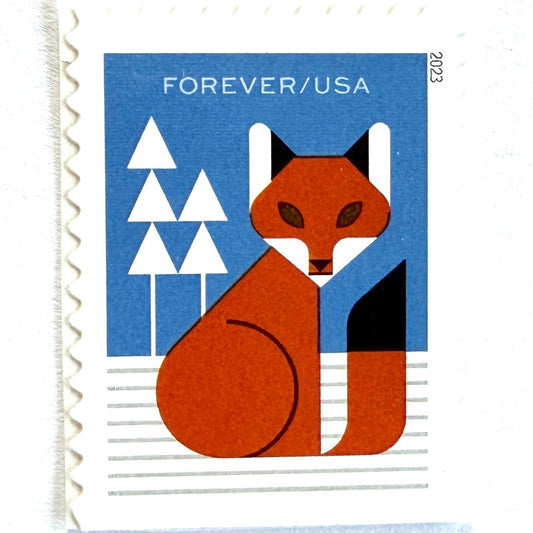 Fox postage stamp from 2023 featuring a stylized red fox in a snowy winter woodland habitat on unused USPS Forever postage, Scott 5825.