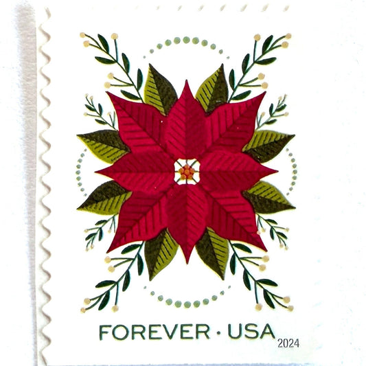Poinsettia Holiday Joy postage stamp from 2024 featuring a vibrant Christmas flower surrounded by decorative greenery on unused USPS Forever postage, Scott 5941.