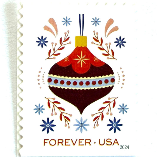 Red Ornament with Blue Flowers Holiday Joy postage stamp from 2024 featuring a colorful folk-art-inspired Christmas ornament on unused USPS Forever postage, Scott 5942.