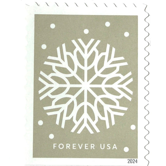 Pale Gray Winter Whimsy Snowflake postage stamp from 2024 featuring a white symmetrical paper-cut-inspired winter design on unused USPS Forever postage, Scott 5950.