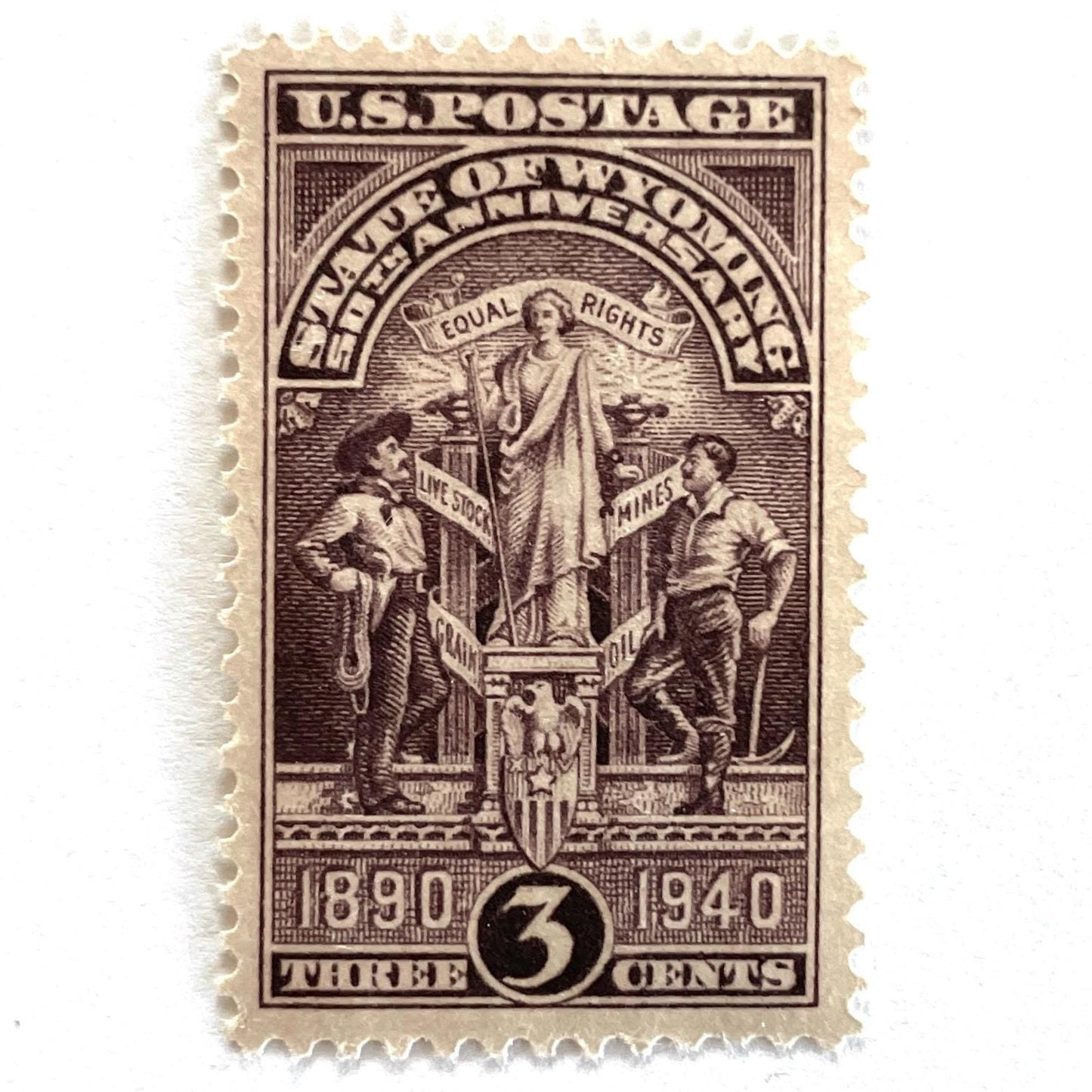 Image of Wyoming Statehood postage stamp from 1940, featuring the Wyoming state seal in brown on vintage unused 3-cent USPS postage, Scott 897.