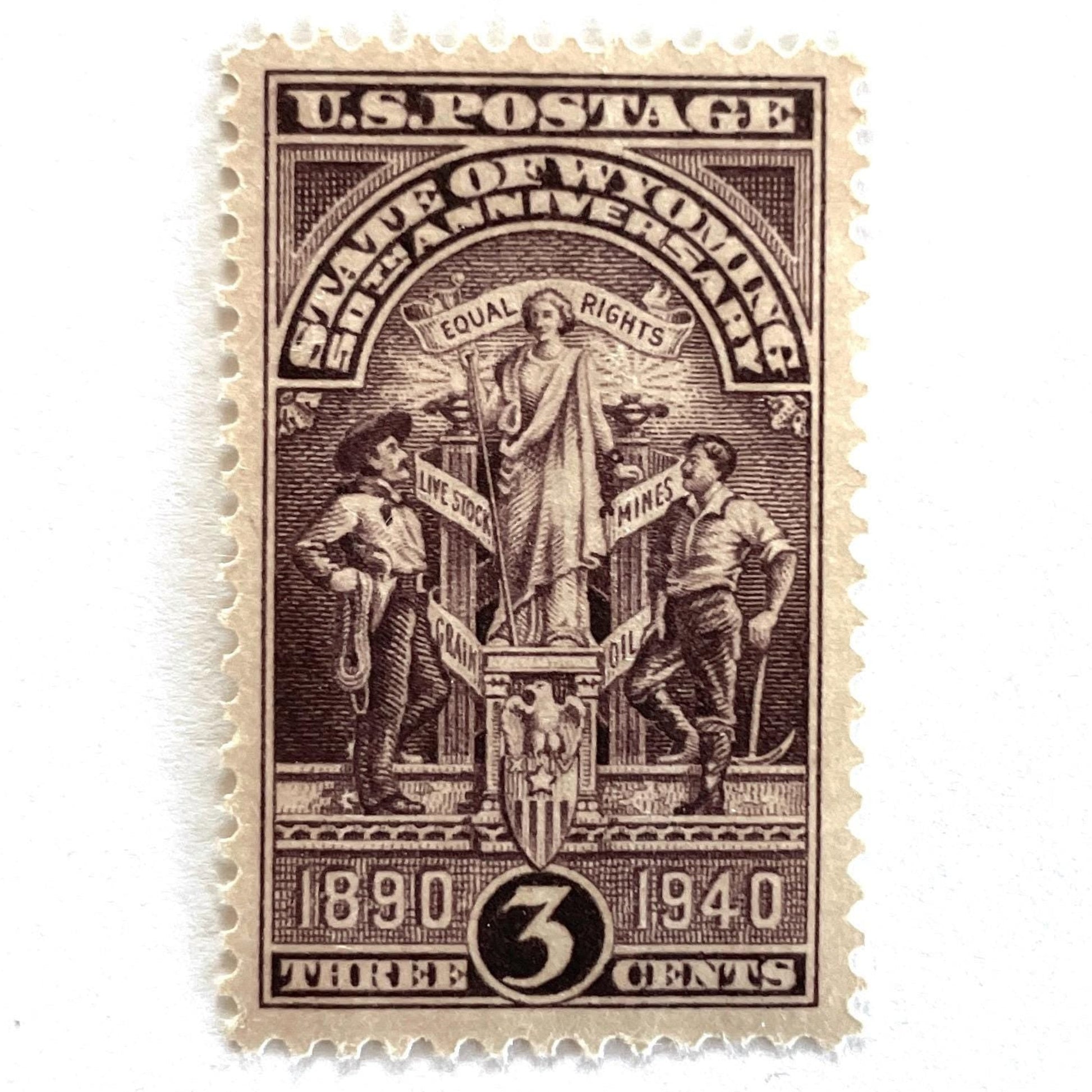 Image of Wyoming Statehood postage stamp from 1940, featuring the Wyoming state seal in brown on vintage unused 3-cent USPS postage, Scott 897.