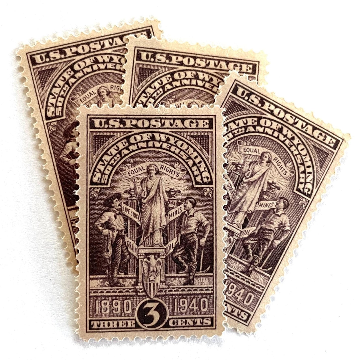 Image of Wyoming Statehood postage stamps from 1940, featuring the Wyoming state seal in brown on vintage unused 3-cent USPS postage, Scott 897.