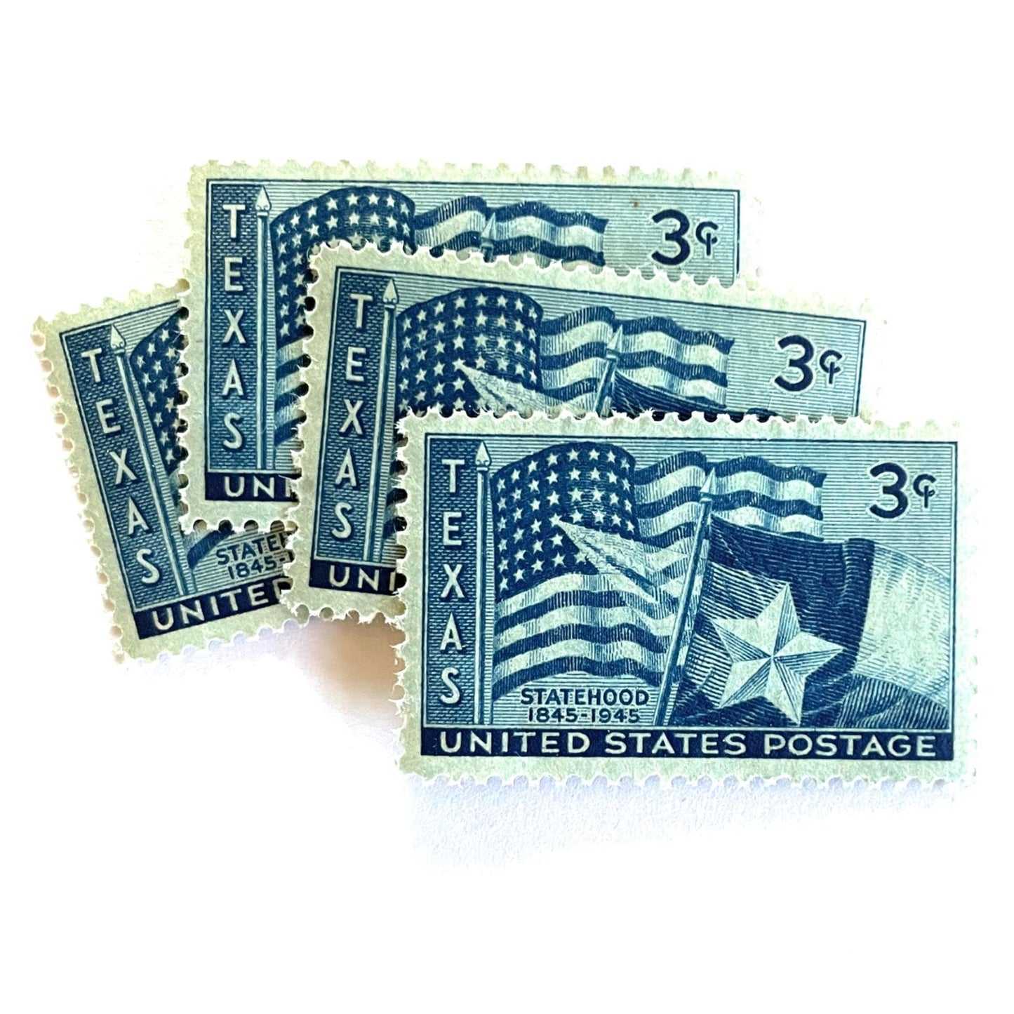 Image of 1945 Texas Statehood 3-cent dark blue postage stamps. Scott #938. Stamp themes: Texas, Lone Star State, Texas flag, U.S. flag, patriotic, statehood centennial, American history.