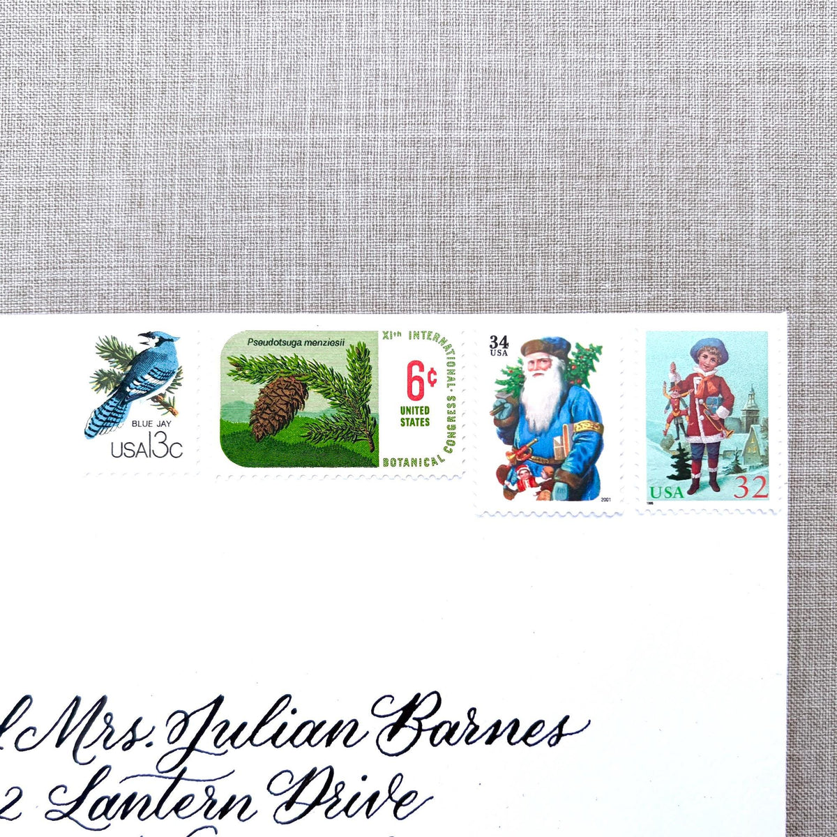 Unused Blue Christmas vintage postage stamp set perfect for adding a special touch to your holiday cards or letters! Each curated set is comprised of four (4) unused stamps with a total USPS postage value of $0.85 (USD) per set — enough postage to mail a standard letter weighing up to 1-ounce.