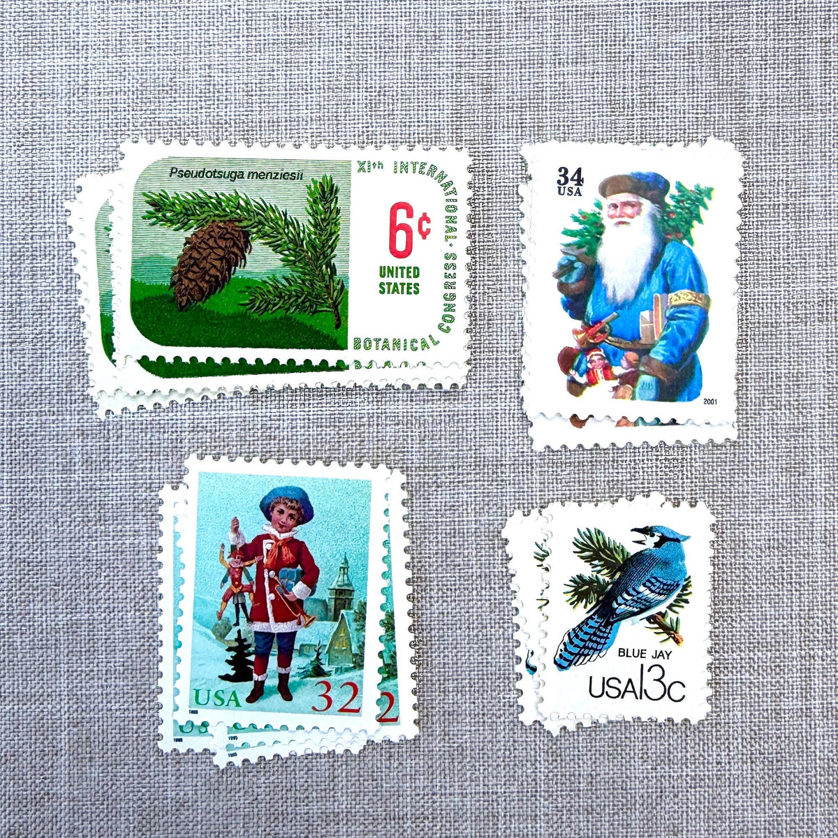 Unused Blue Christmas vintage postage stamp set perfect for adding a special touch to your holiday cards or letters! Each curated set is comprised of four (4) unused stamps with a total USPS postage value of $0.85 (USD) per set — enough postage to mail a standard letter weighing up to 1-ounce.