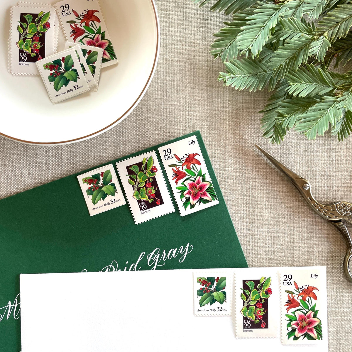 Unused “Botanical Christmas” vintage postage stamp set perfect for adding a special touch to your holiday cards or letters! Each curated set is comprised of three (3) unused stamps with a total USPS postage value of $0.90 (USD) per set — enough postage to mail a standard letter weighing up to 1-ounce.
