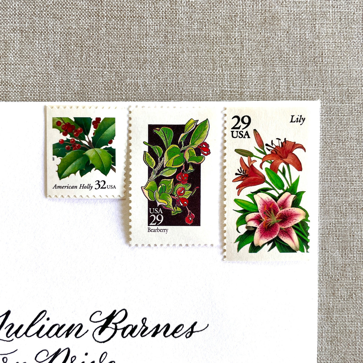 Unused “Botanical Christmas” vintage postage stamp set perfect for adding a special touch to your holiday cards or letters! Each curated set is comprised of three (3) unused stamps with a total USPS postage value of $0.90 (USD) per set — enough postage to mail a standard letter weighing up to 1-ounce.