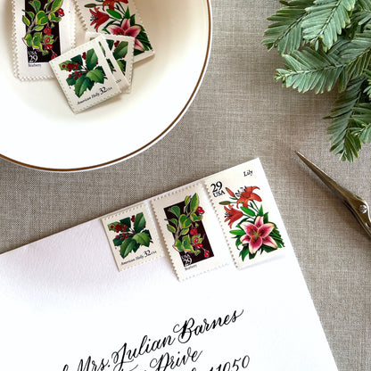 Unused “Botanical Christmas” vintage postage stamp set perfect for adding a special touch to your holiday cards or letters! Each curated set is comprised of three (3) unused stamps with a total USPS postage value of $0.90 (USD) per set — enough postage to mail a standard letter weighing up to 1-ounce.