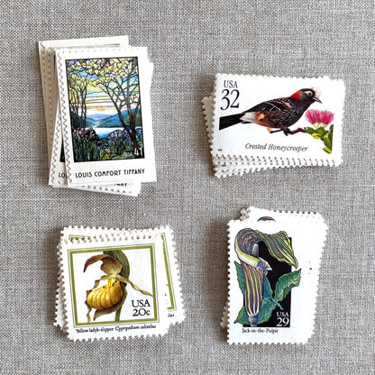 Vintage botanical postage stamp set featuring Crested Honeycreeper, Lady’s-Slipper Orchid, Jack-in-the-Pulpit Wildflower, and Louis Comfort Tiffany unused U.S. stamps for wedding invitations and save-the-dates.