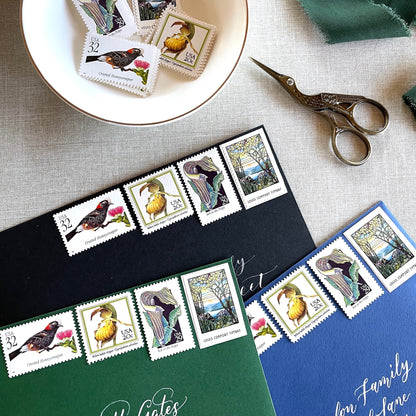Vintage botanical postage stamp set featuring Crested Honeycreeper, Lady’s-Slipper Orchid, Jack-in-the-Pulpit Wildflower, and Louis Comfort Tiffany unused U.S. stamps for wedding invitations and save-the-dates.