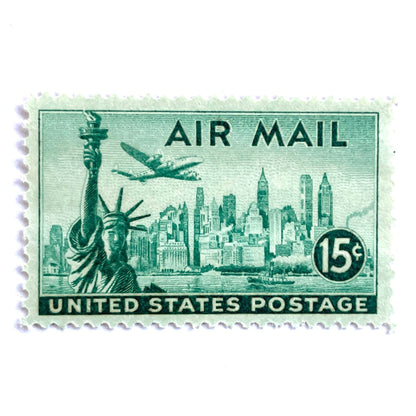 Image of 1947 “New York Skyline” 15-cent Air Mail stamps. Scott #C35. Stamp Themes: New York, NYC, Big Apple, Statue of Liberty, Chrysler Building, Air Mail, Air Travel, Transportation. Green postage stamp.
