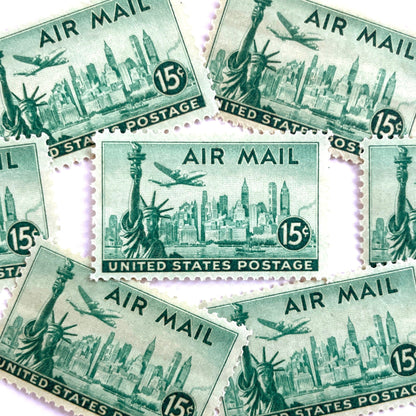 Image of 1947 “New York Skyline” 15-cent Air Mail stamps. Scott #C35. Stamp Themes: New York, NYC, Big Apple, Statue of Liberty, Chrysler Building, Air Mail, Air Travel, Transportation. Green postage stamp.