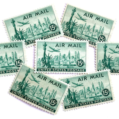 Image of 1947 “New York Skyline” 15-cent Air Mail stamps. Scott #C35. Stamp Themes: New York, NYC, Big Apple, Statue of Liberty, Chrysler Building, Air Mail, Air Travel, Transportation. Green postage stamp.