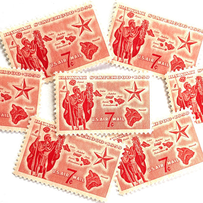 Image of Hawaii Statehood airmail postage stamps from 1959, featuring a Hawaiian Aliʻi extending a lei, a map of the Hawaiian Islands, and a star of statehood on vintage unused 7-cent USPS postage, Scott C55.