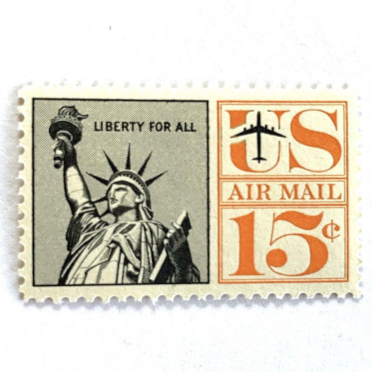 Image of 1959-1961 “Statue of Liberty” 15-cent air mail stamps. Scott #C58. Stamp Themes: Statue of Liberty, NYC, New York City, Big Apple, Air Mail. Black and orange postage stamp.