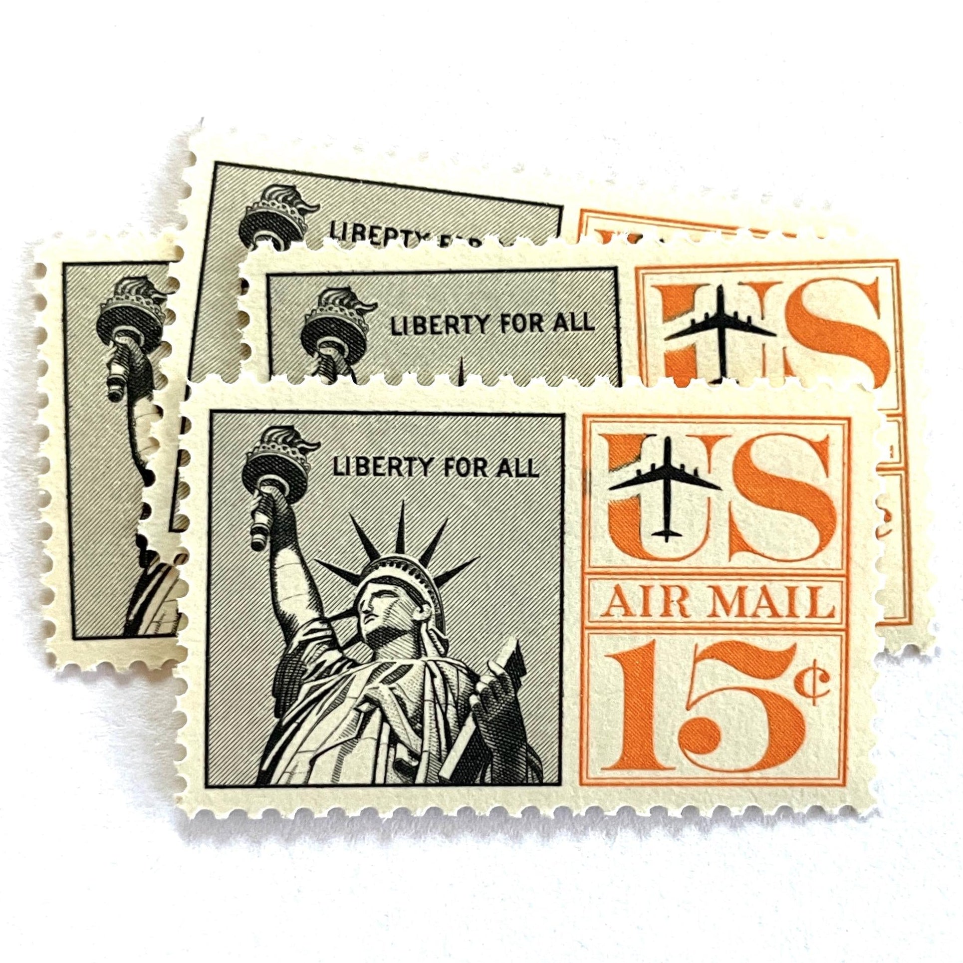 Image of 1959-1961 “Statue of Liberty” 15-cent air mail stamps. Scott #C58. Stamp Themes: Statue of Liberty, NYC, New York City, Big Apple, Air Mail. Black and orange postage stamp.