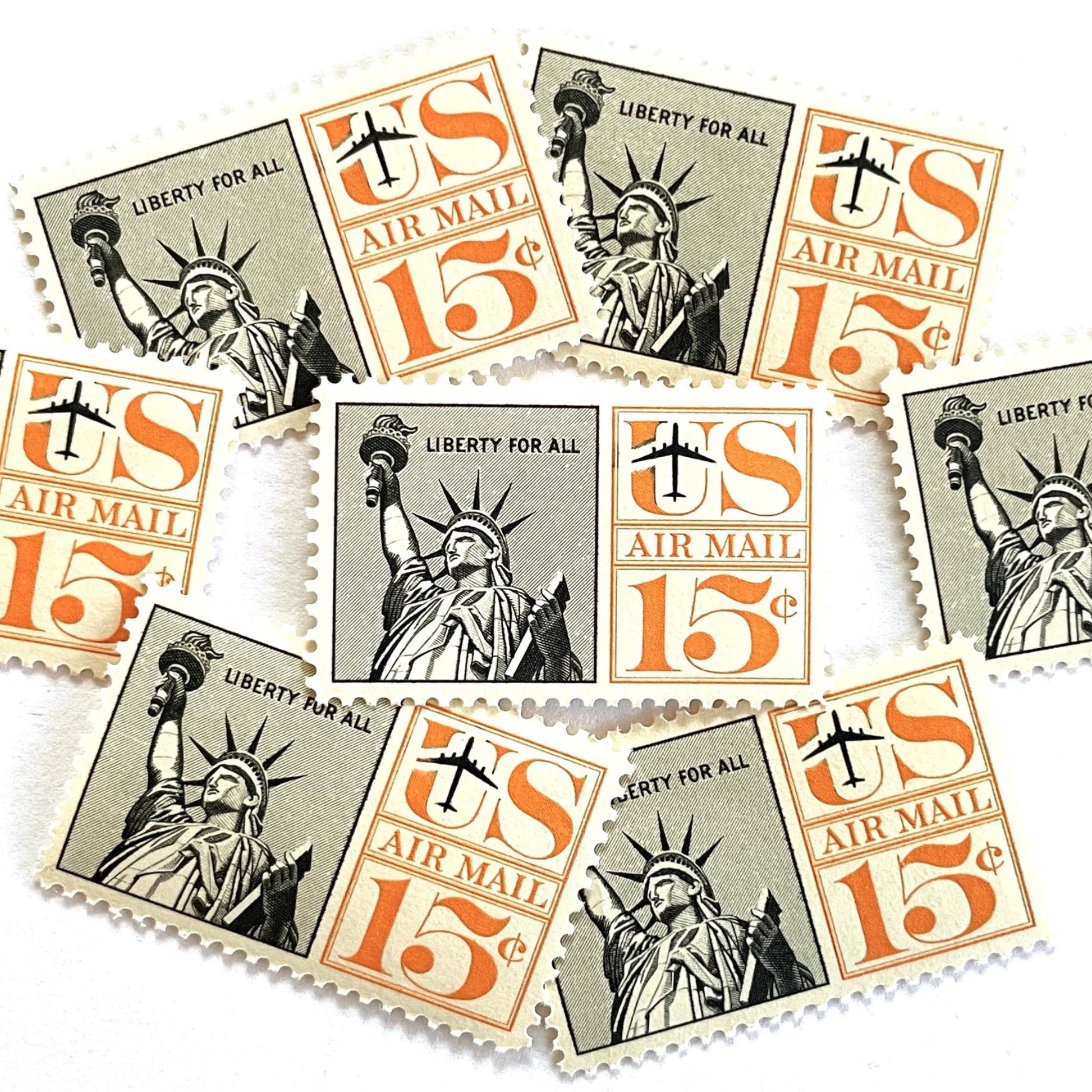Image of 1959-1961 “Statue of Liberty” 15-cent air mail stamps. Scott #C58. Stamp Themes: Statue of Liberty, NYC, New York City, Big Apple, Air Mail. Black and orange postage stamp.