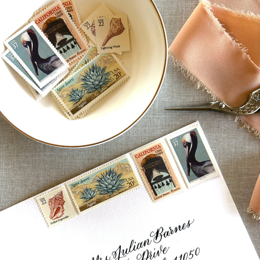 Unused vintage stamp set perfect for mailing California wedding invitations, save-the-dates, or other special correspondence. Each curated set is comprised of four unused stamps with a total USPS postage value of 85 cents, enough postage to mail a standard rectangular envelope that weighs up to one ounce. These stamps are perfectly valid for use as postage for mailing with USPS.