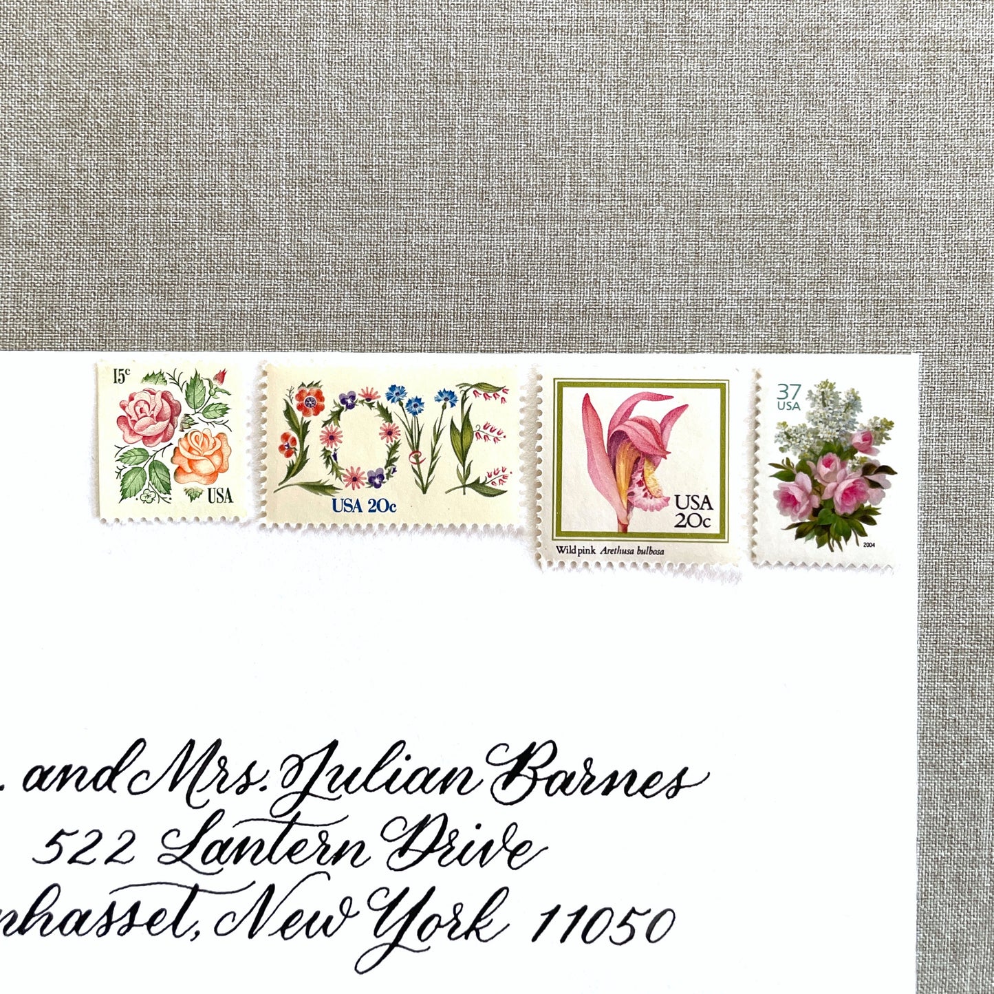 ALT TEXT:  Image of four unused vintage stamps curated and arranged in a USPS postage stamp set for mailing floral and love-themed save-the-dates, wedding invitations, bridal shower invitations, and other special correspondence. This postage stamp set is called the “Pink Floral Love” set, is botanically themed, with pink as the predominant color. The total face value of the set is 92-cents USD.