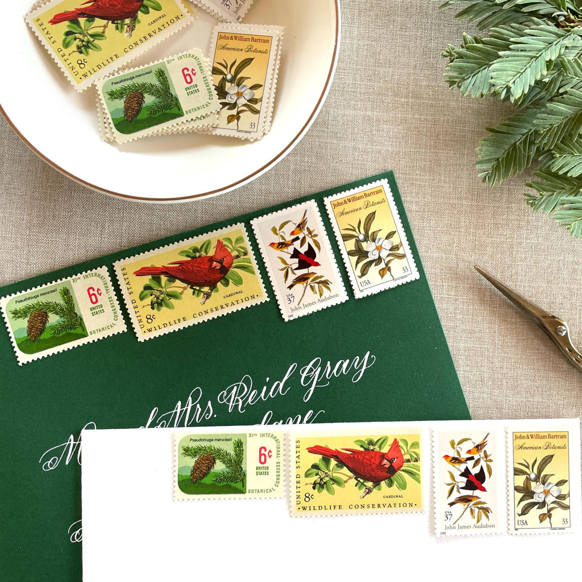 Unused “Gold Botanical Christmas” vintage postage stamp set perfect for adding a special touch to your holiday cards or letters! Each curated set is comprised of four (4) unused stamps with a total USPS postage value of $0.84 (USD) per set — enough postage to mail a standard letter weighing up to 1-ounce.