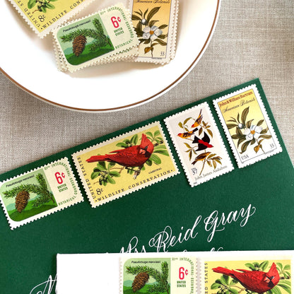 Unused “Gold Botanical Christmas” vintage postage stamp set perfect for adding a special touch to your holiday cards or letters! Each curated set is comprised of four (4) unused stamps with a total USPS postage value of $0.84 (USD) per set — enough postage to mail a standard letter weighing up to 1-ounce.