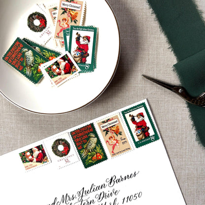 Unused “Green Wreath Christmas” vintage postage stamp set perfect for adding a special touch to your holiday cards or letters! Each curated set is comprised of five (5) unused stamps with a total USPS postage value of $0.87 (USD) per set — enough postage to mail a standard letter weighing up to 1-ounce.