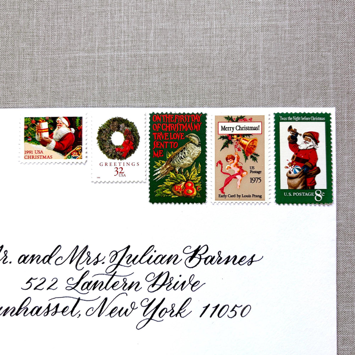 Unused “Green Wreath Christmas” vintage postage stamp set perfect for adding a special touch to your holiday cards or letters! Each curated set is comprised of five (5) unused stamps with a total USPS postage value of $0.87 (USD) per set — enough postage to mail a standard letter weighing up to 1-ounce.
