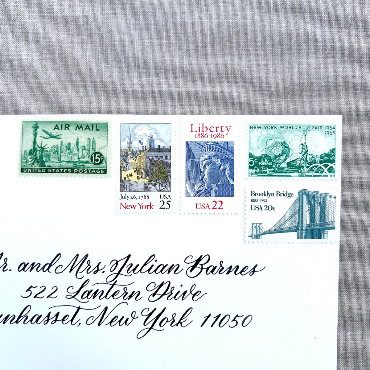 Unused vintage stamp set perfect for mailing New York or NYC-themed wedding invitations, save-the-dates, engagement announcements, bridal shower invites, thank you notes, or other special correspondence. Each curated set is comprised of five unused stamps with a total USPS postage value of 87 cents, enough postage to mail a standard letter weighing up to 1 ounce. These unused U.S. stamps are perfectly valid for use as postage.