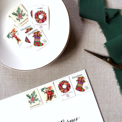 Unused Pink Christmas vintage stamp set perfect for adding a special touch to your holiday cards or letters! Each curated set is comprised of four (4) unused stamps with a total USPS postage value of $0.98 (USD) per set — enough postage to mail a standard letter weighing up to 1-ounce.