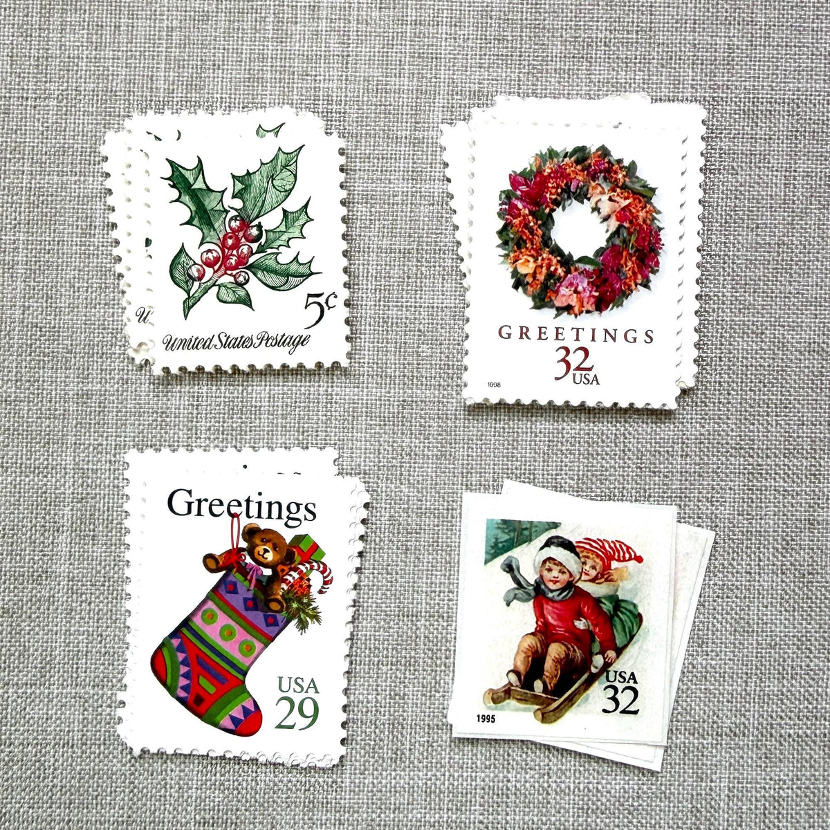 Unused Pink Christmas vintage stamp set perfect for adding a special touch to your holiday cards or letters! Each curated set is comprised of four (4) unused stamps with a total USPS postage value of $0.98 (USD) per set — enough postage to mail a standard letter weighing up to 1-ounce.