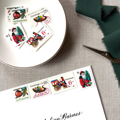 Unused “Red Train Christmas” vintage postage stamp set perfect for adding a special touch to your holiday cards or letters! Each curated set is comprised of four (4) unused stamps with a total USPS postage value of $0.87 (USD) per set — enough postage to mail a standard letter weighing up to 1-ounce.