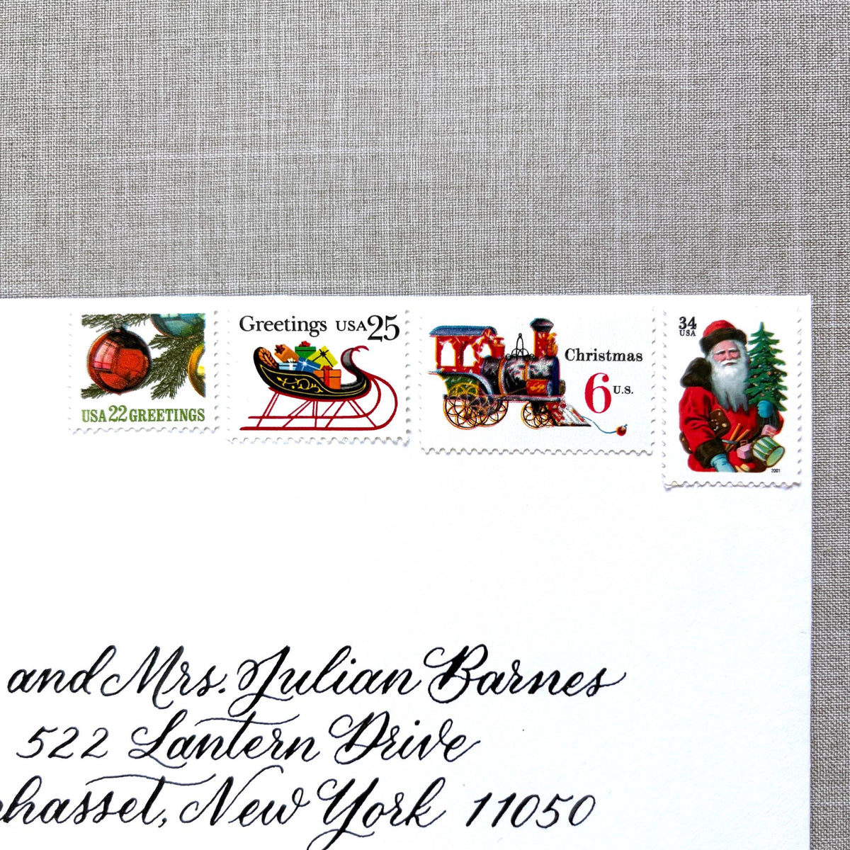 Unused “Red Train Christmas” vintage postage stamp set perfect for adding a special touch to your holiday cards or letters! Each curated set is comprised of four (4) unused stamps with a total USPS postage value of $0.87 (USD) per set — enough postage to mail a standard letter weighing up to 1-ounce.